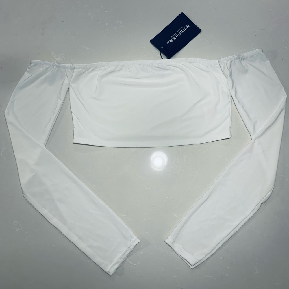 White long sleeve crop top in size (2) with tags still attached!